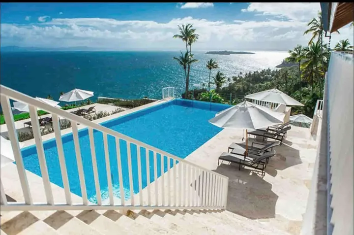 Pool and the bay from the steps of Samaná Capri View